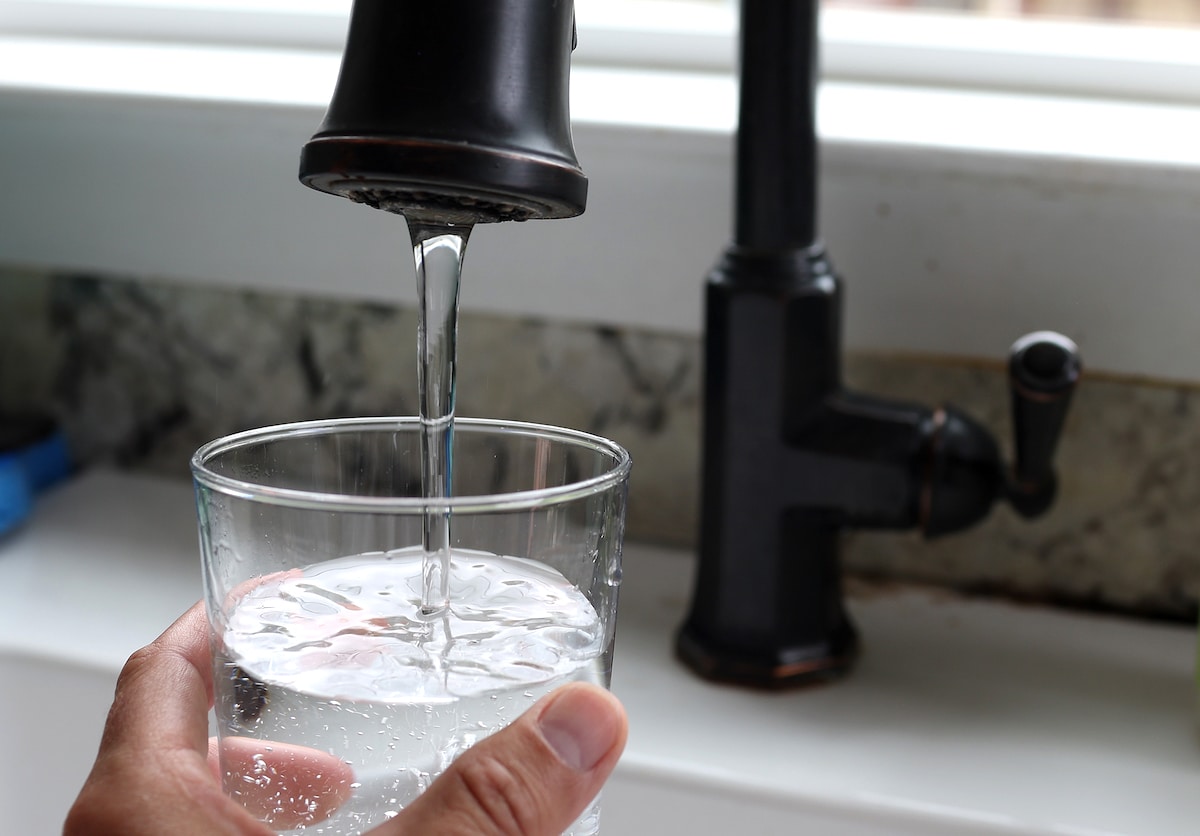 Water from the tap fills a glass in San Anselmo, California