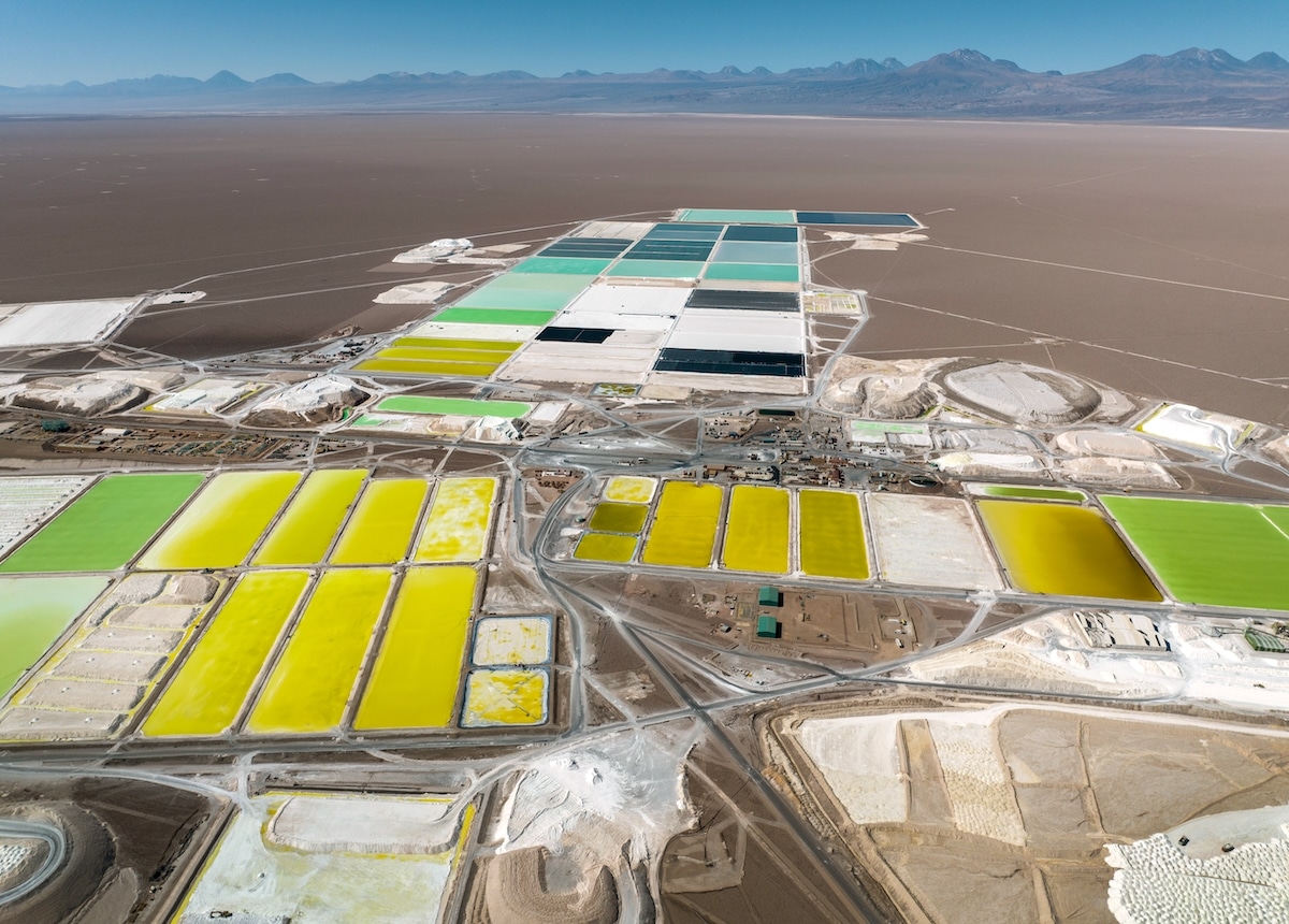 Pools of brine containing lithium carbonate and mounds of salt bi-product stretch through a lithium mine in the Atacama Desert in Salar de Atacama, Chile