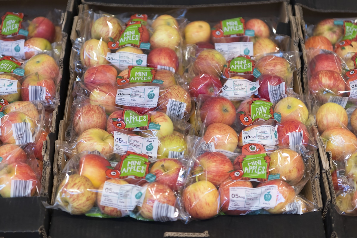 Apples wrapped in plastic packaging in a supermarket in Cardiff, United Kingdom